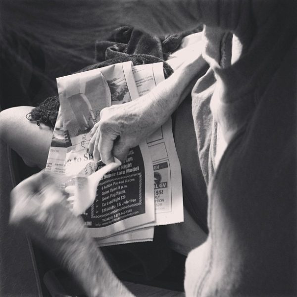 black & white photo of alzheimer's patient tearing up paper